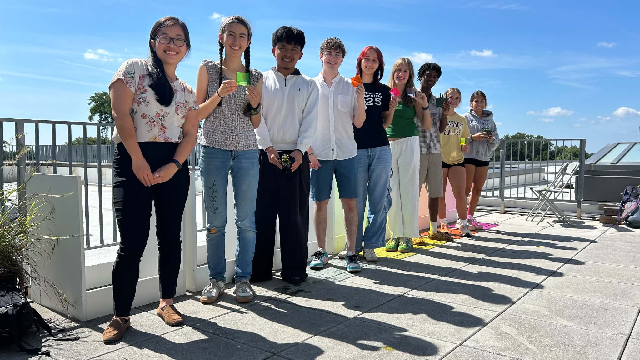 A more formal group photo of the Loh Lab on the greenhouse roof.