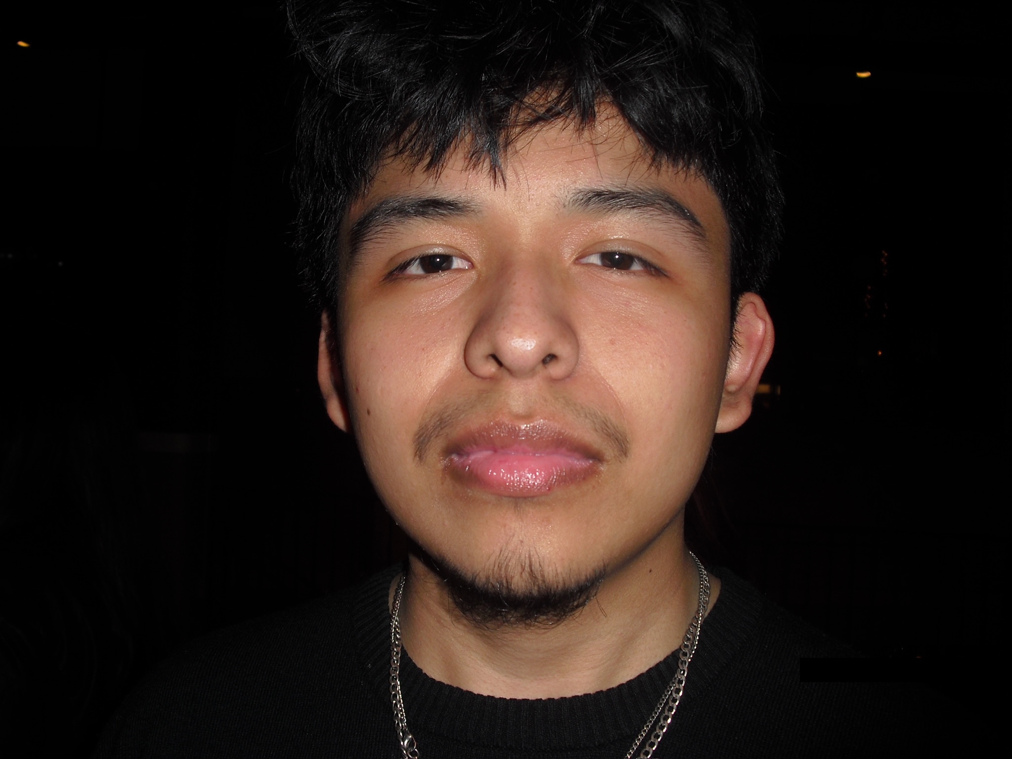 Headshot of Osmar Jimenez Ventura looking into the camera and wearing a black shirt.
